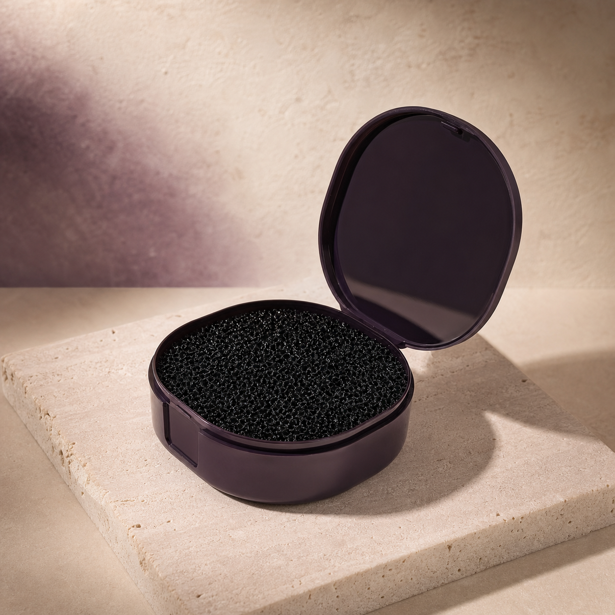 ColourSwitch Brush-Cleaning Sponge photographed on a warm ivory and blush studio backdrop