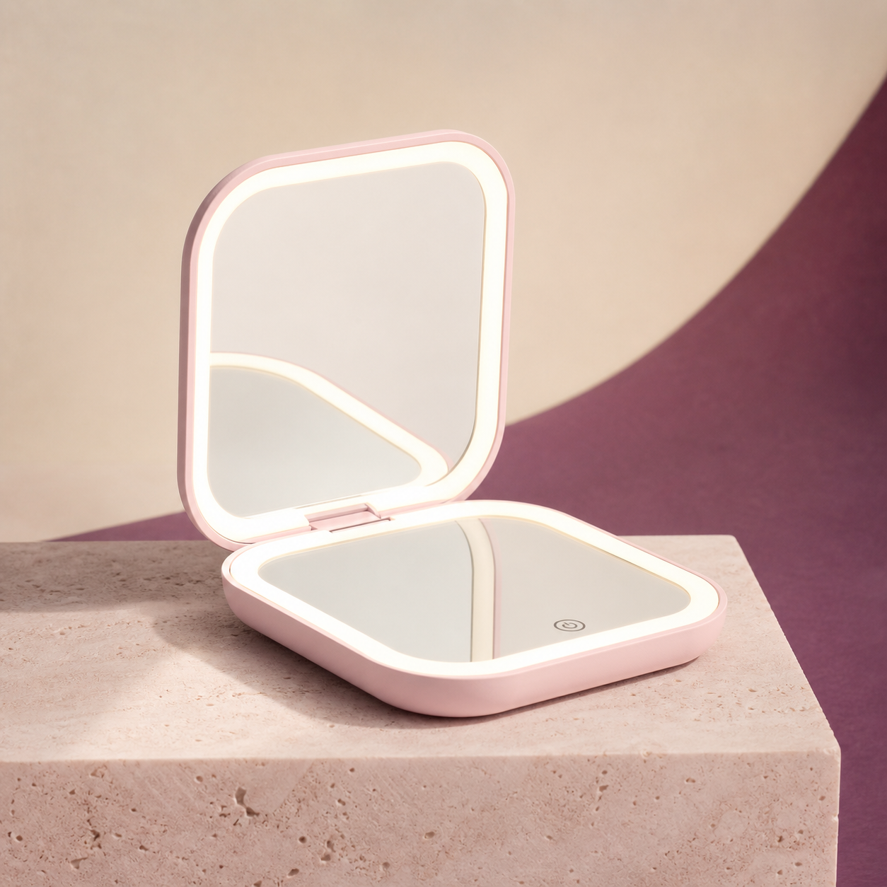 GlowFold Rechargeable LED Makeup Mirror photographed on a warm ivory and blush studio backdrop