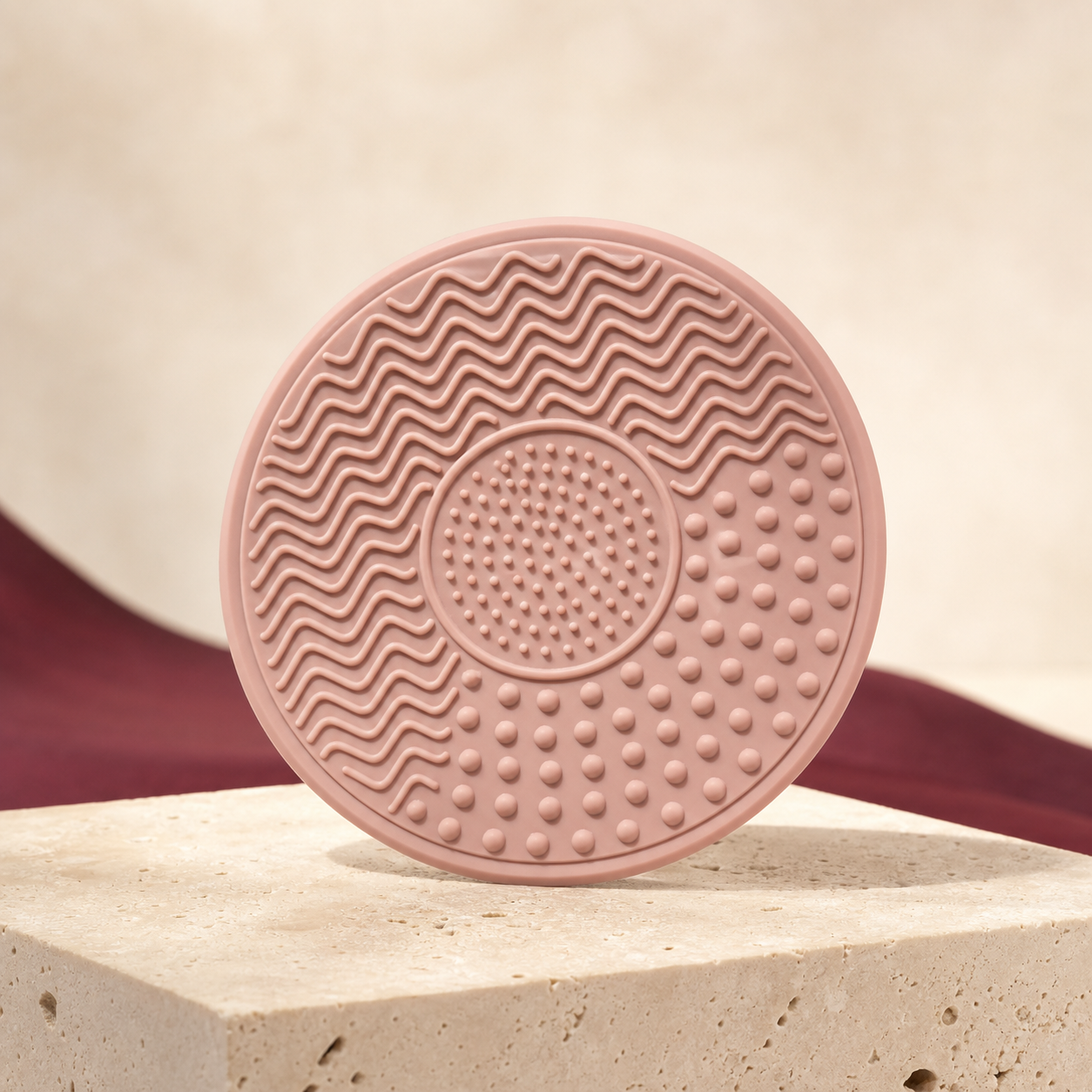 Textured Silicone Brush-Cleaning Mat photographed on a warm ivory and blush studio backdrop