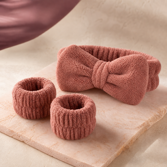 CloudSoft Spa Headband & Wristband Set photographed on a warm ivory and blush studio backdrop